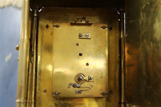 A lantern clock with later movement